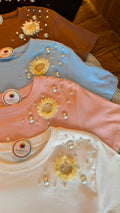 Blusas c/detalhe flor